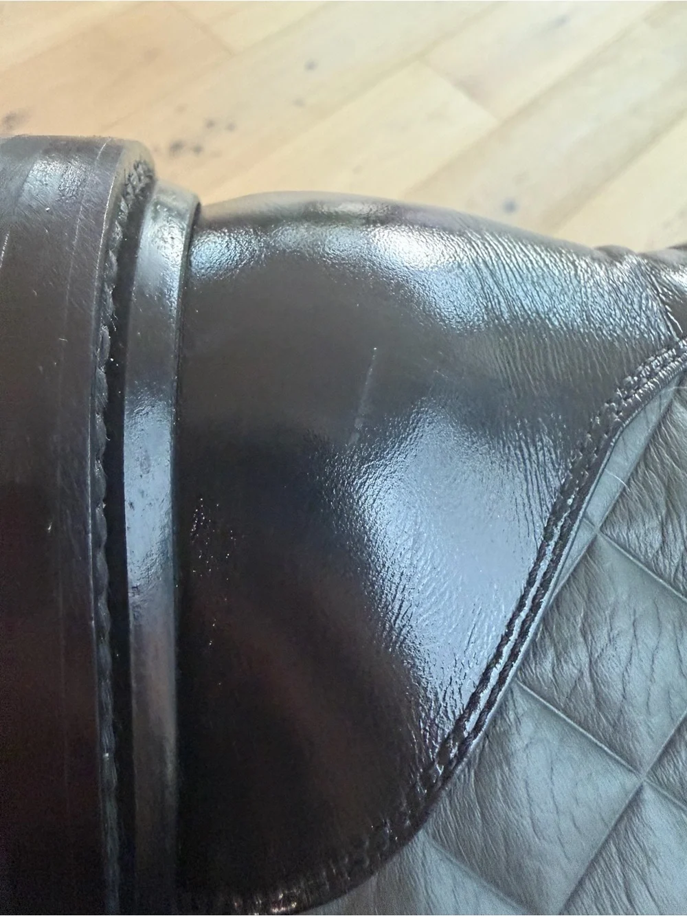 CHANEL Black Quilted Leather Combat Boots with Patent Toe